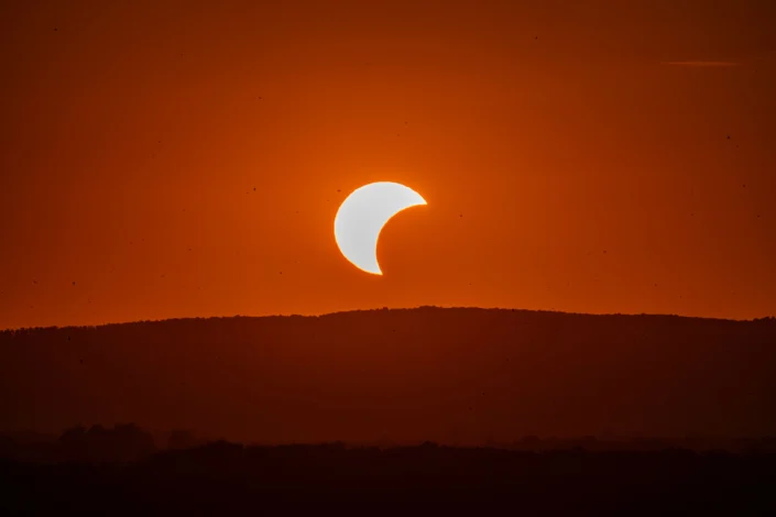 Beautiful solar eclipse at sunset over Garešnica in Bjelovarsko-bilogorska, Croatia.